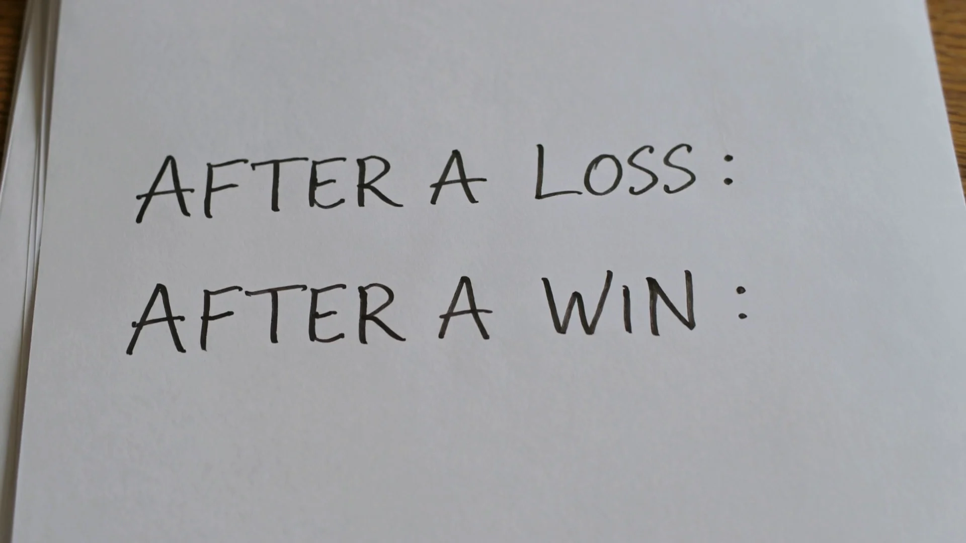 Handwritten note reading AFTER A LOSS and AFTER A WIN with identical values