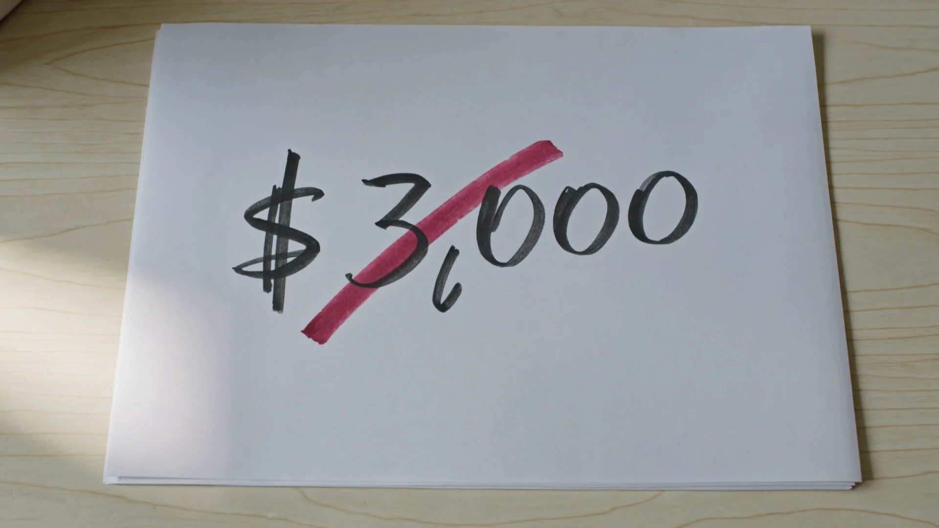 A handwritten note reading $3,000 with the figure crossed out, illustrating the buffer that shrinks after a payout